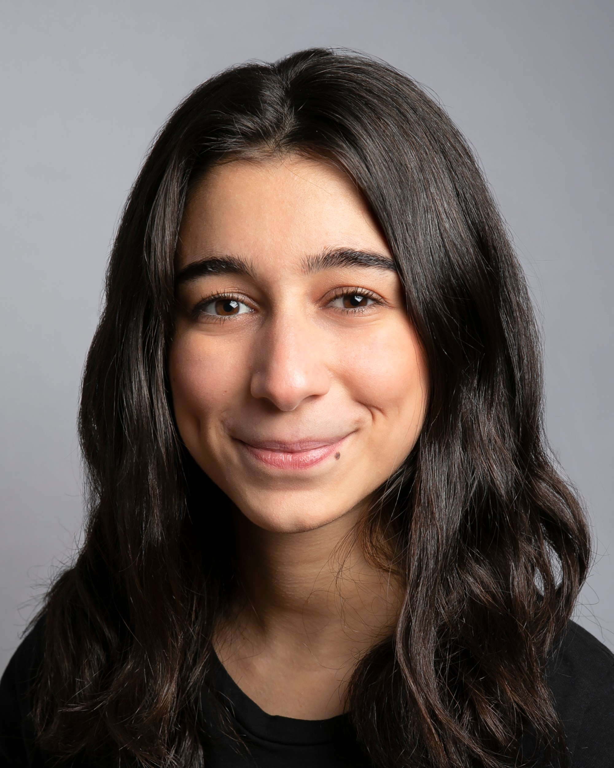 A photo of a woman with long brown hair