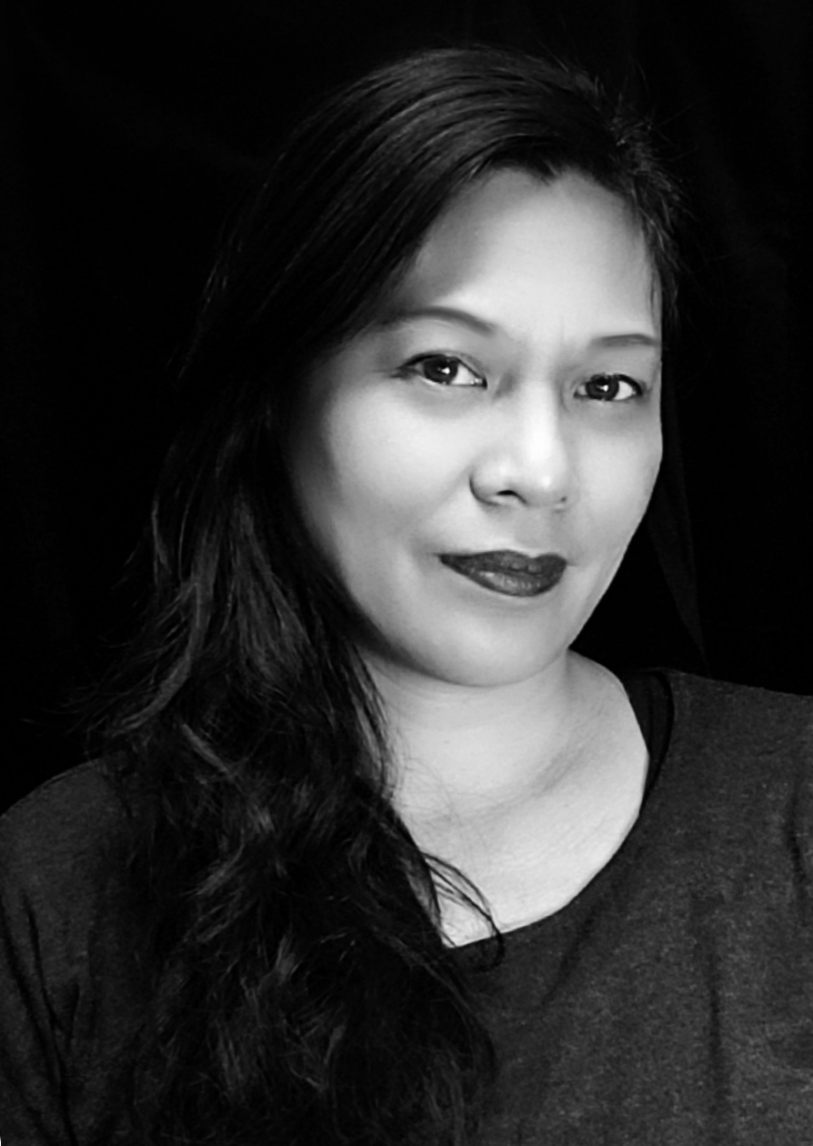 Black and white photo of Carmelle a Filipino woman with long black hair.