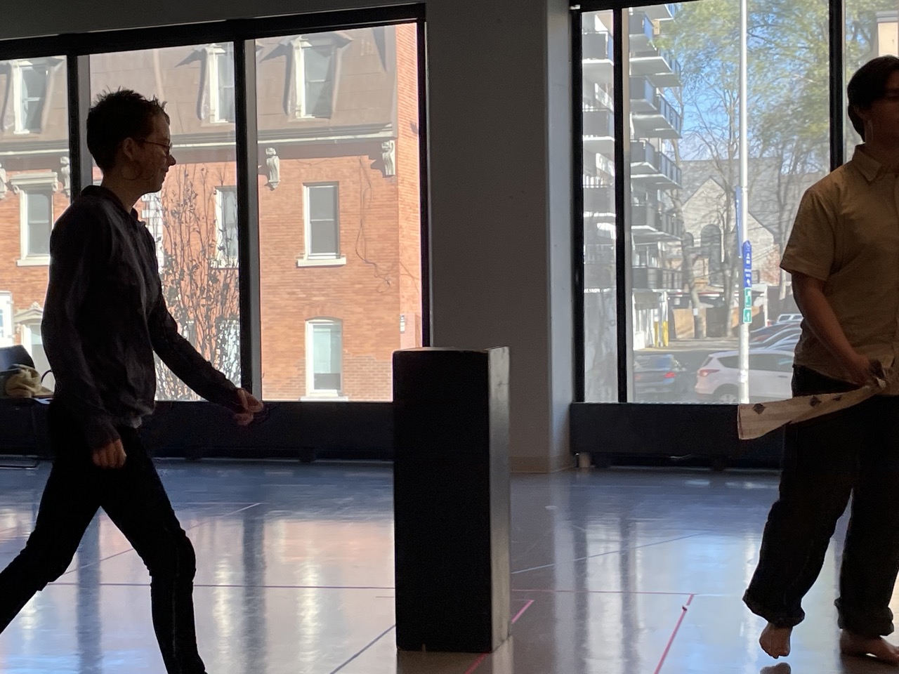 A youth sneaks up on another